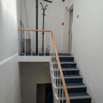 Mezzanine staircase to penthouse lounge-kitchen-diner