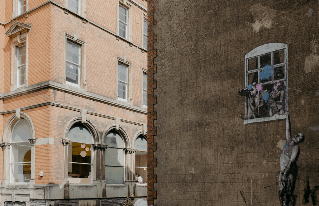 "Well Hung Lover" by Banksy